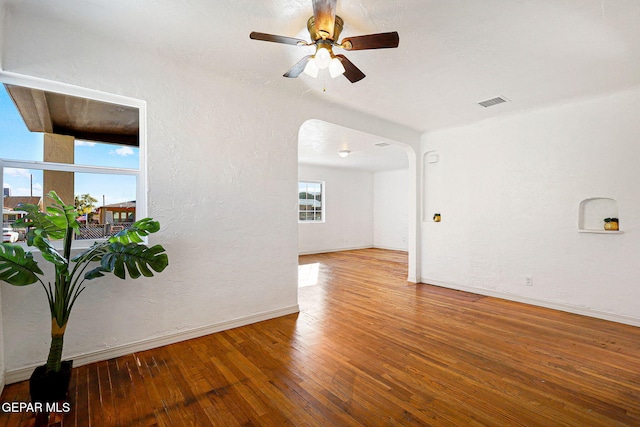 empty room featuring wood-type flooring and ceiling fan