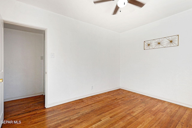 empty room featuring dark hardwood / wood-style flooring and ceiling fan