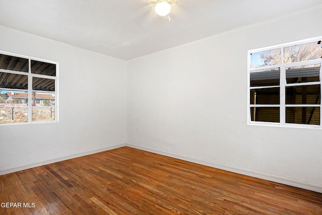 spare room with hardwood / wood-style flooring