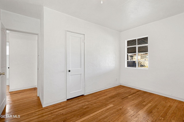 interior space with light hardwood / wood-style floors and a closet