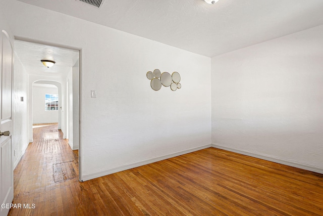 empty room featuring wood-type flooring