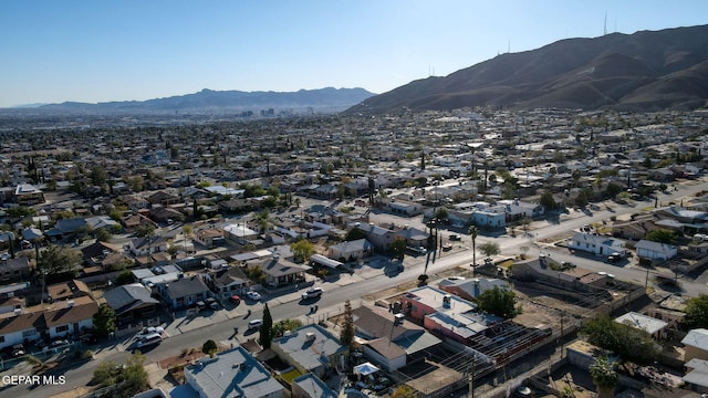 birds eye view of property with a mountain view