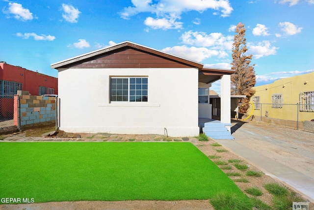 exterior space with a front yard