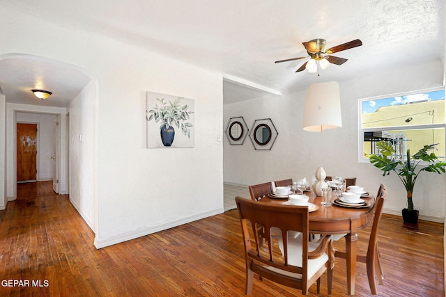 dining area featuring dark hardwood / wood-style floors and ceiling fan