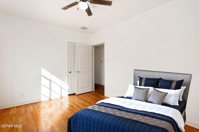 bedroom featuring wood-type flooring and ceiling fan