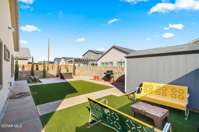 view of patio / terrace featuring an outbuilding and area for grilling