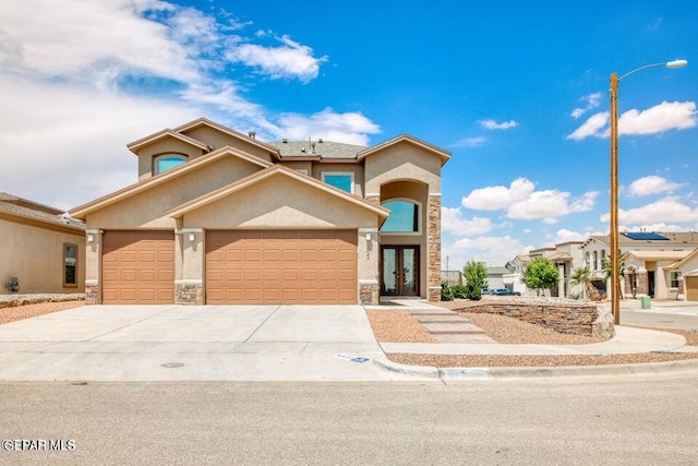 view of front of house featuring a garage and french doors