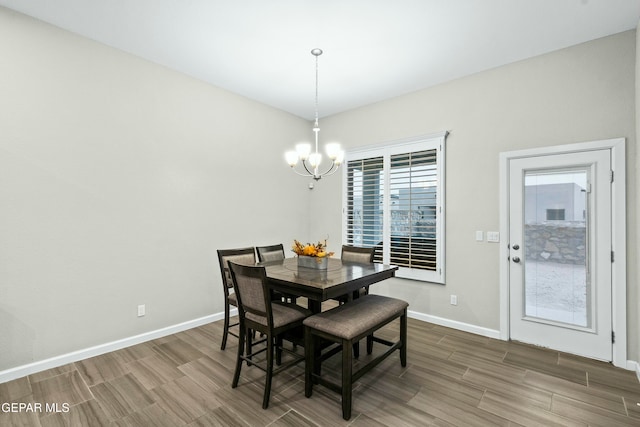 dining space featuring a chandelier and hardwood / wood-style floors