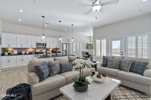 15224 Gauge Ct, El Paso, TX 79938 - living area with recessed lighting, a ceiling fan, and light wood-style flooring