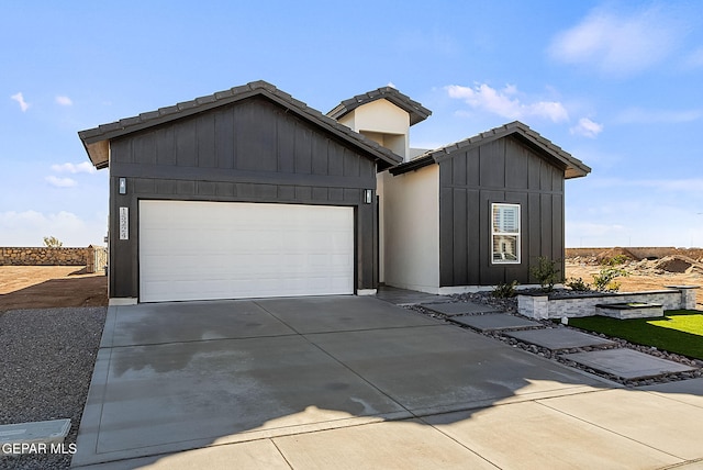15224 Gauge Ct, El Paso, TX 79938 - view of front of property with driveway, a garage, and a tile roof