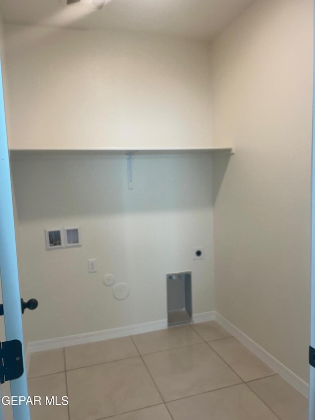 laundry area with gas dryer hookup, hookup for an electric dryer, washer hookup, and tile patterned flooring