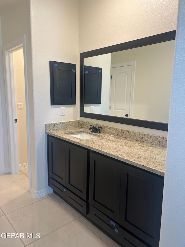 bathroom with vanity and tile patterned flooring