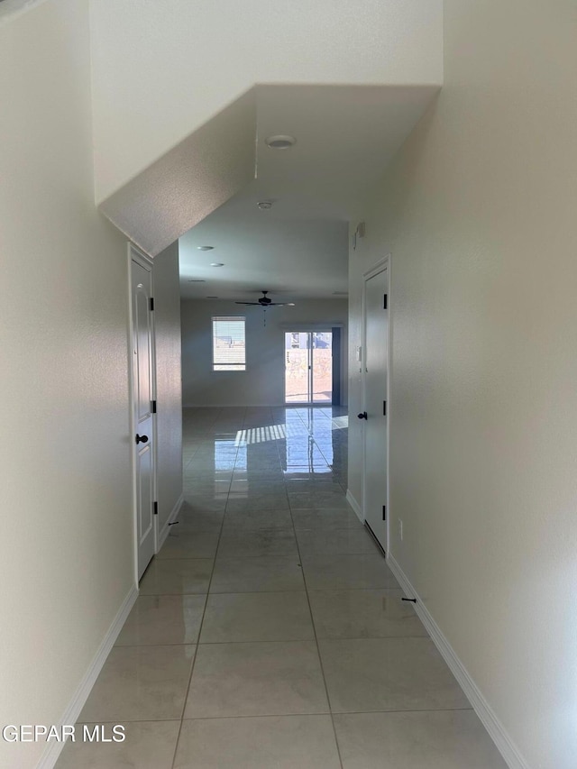 hallway featuring tile patterned flooring