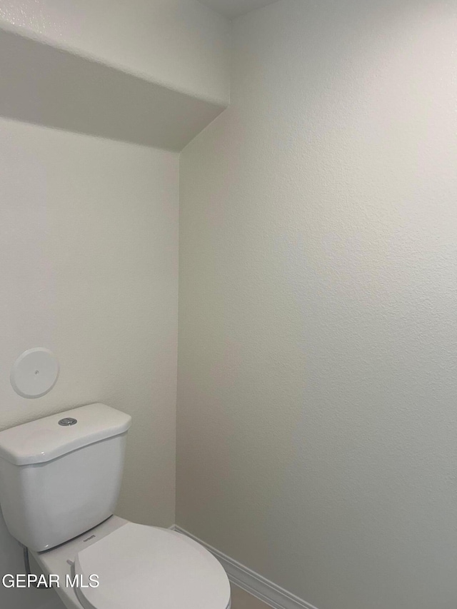 bathroom featuring toilet