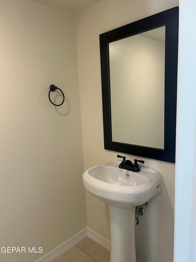 bathroom with tile patterned floors