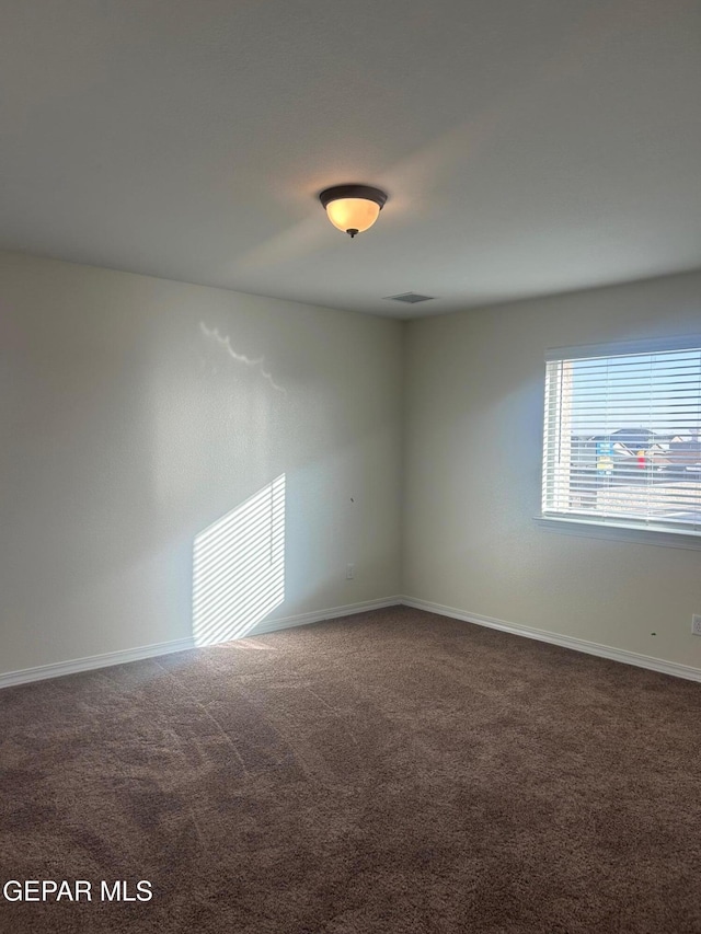 unfurnished room with carpet