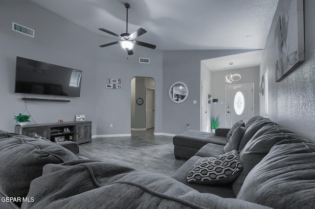 living room featuring ceiling fan, hardwood / wood-style floors, and high vaulted ceiling