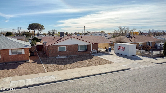 ranch-style house featuring central air condition unit