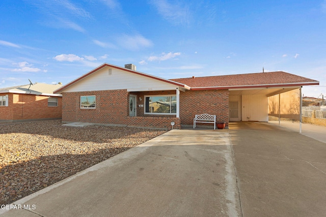 ranch-style house featuring a carport