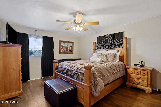 bedroom with ceiling fan and dark hardwood / wood-style flooring