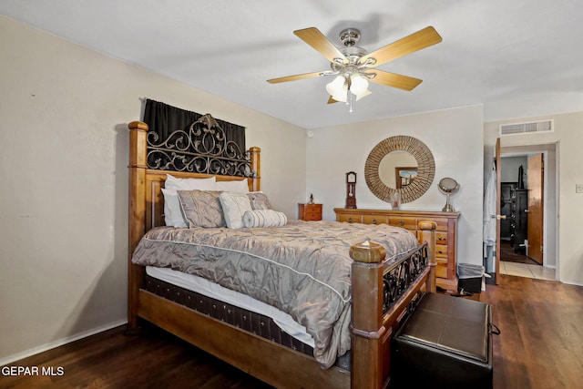 bedroom with ceiling fan and dark wood-type flooring