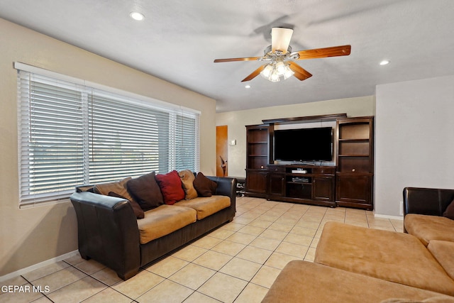 tiled living room featuring ceiling fan