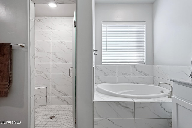 bathroom featuring plus walk in shower and vanity