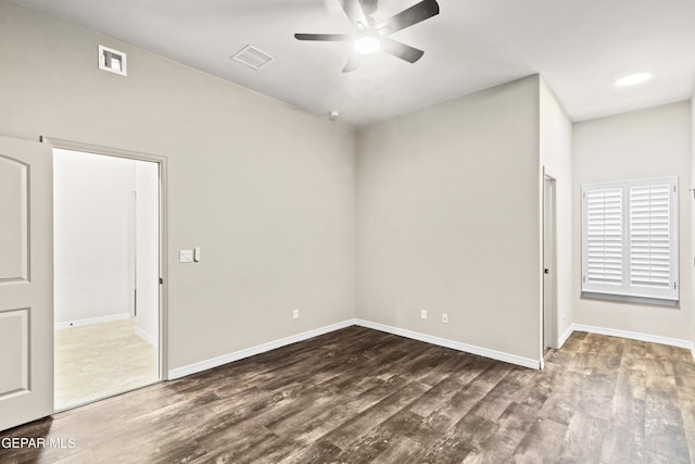 spare room with hardwood / wood-style floors and ceiling fan