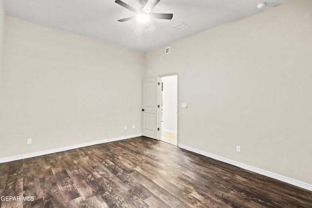 unfurnished room featuring ceiling fan and dark hardwood / wood-style flooring