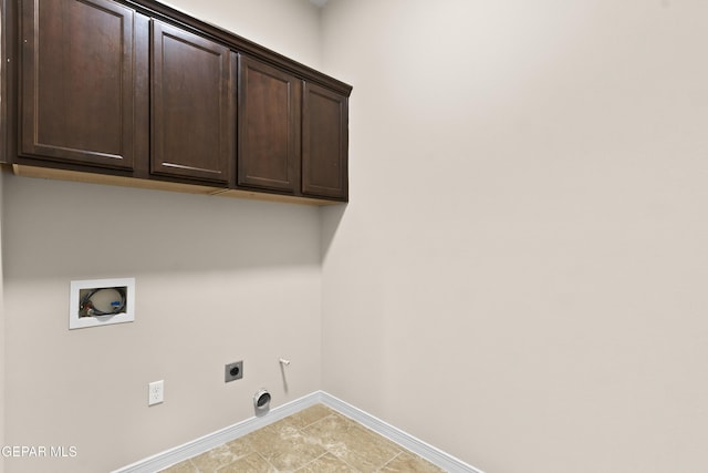 laundry room with cabinets, hookup for an electric dryer, and hookup for a washing machine