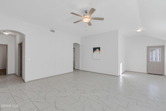 unfurnished living room with ceiling fan and lofted ceiling