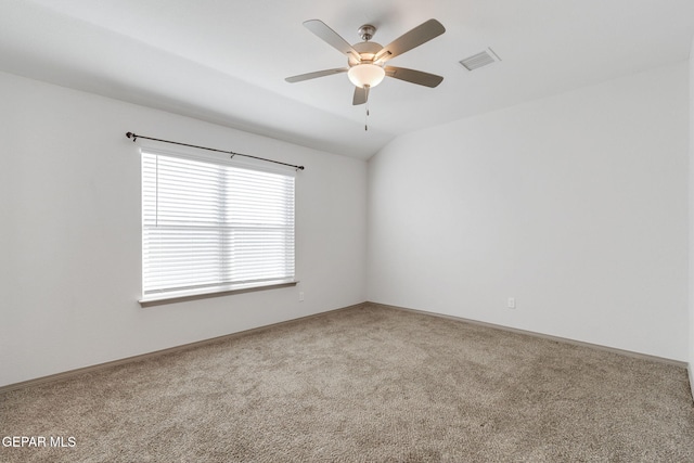 spare room with carpet flooring, ceiling fan, and lofted ceiling