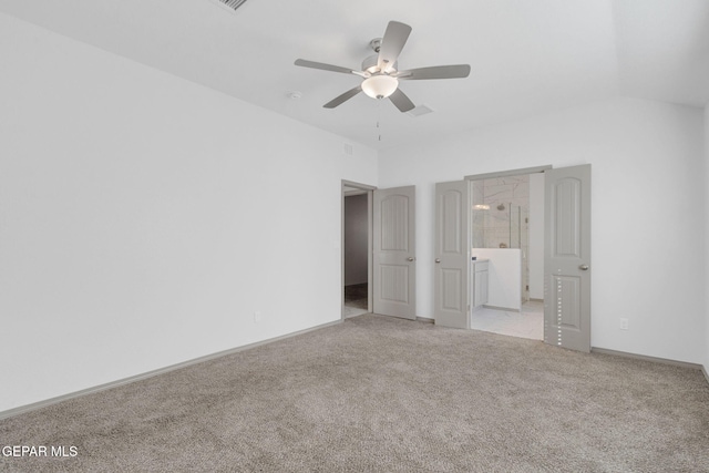 unfurnished bedroom with ensuite bath, ceiling fan, and light colored carpet