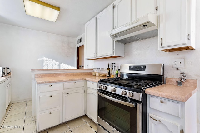 kitchen with white cabinetry, light tile patterned flooring, and stainless steel range with gas stovetop