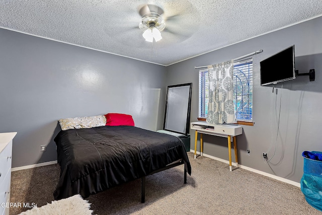 bedroom with carpet flooring, ceiling fan, and a textured ceiling