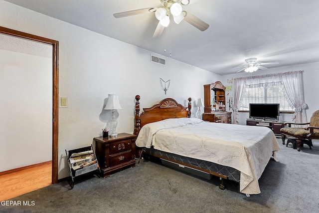 bedroom with dark carpet and ceiling fan