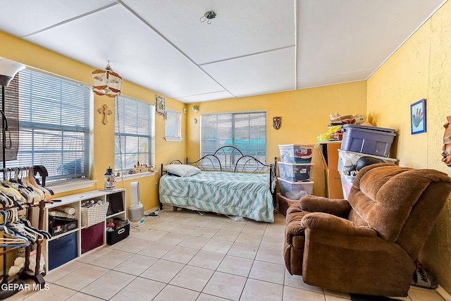 bedroom with light tile patterned floors