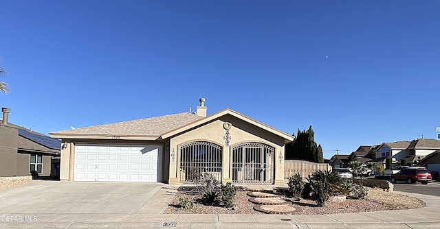 single story home with a garage