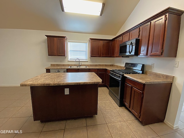 kitchen with lofted ceiling, sink, light tile patterned floors, black gas range oven, and a kitchen island