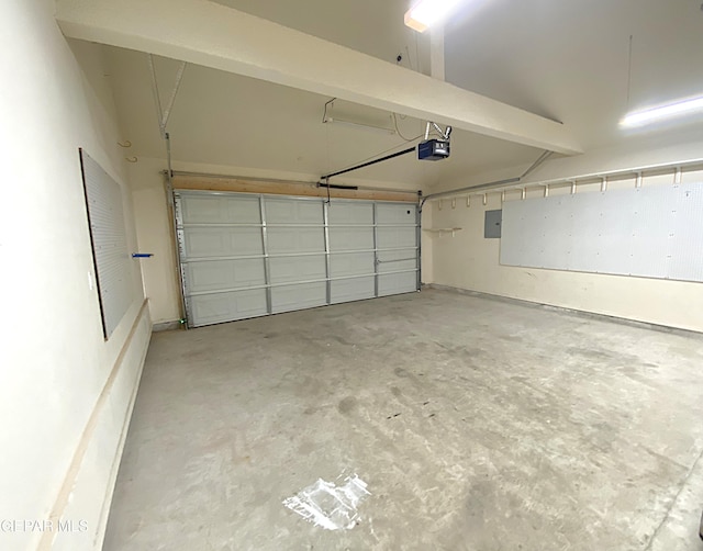 garage featuring electric panel and a garage door opener