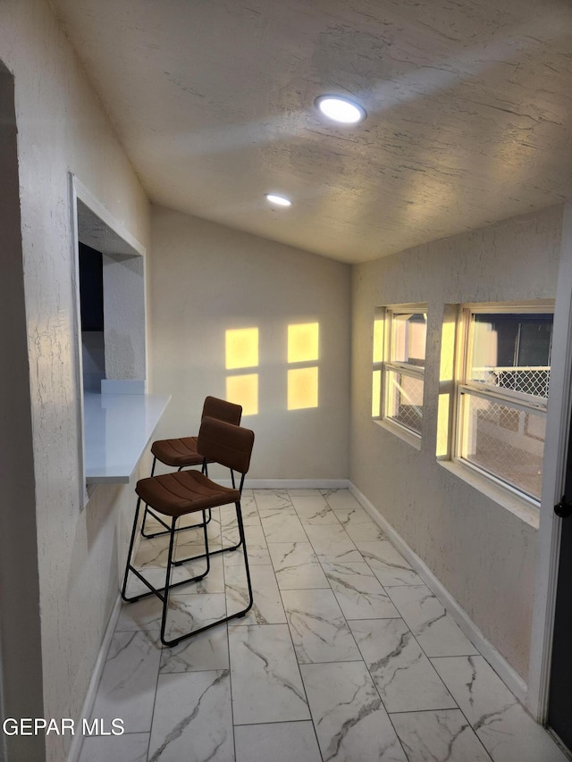 office space featuring lofted ceiling