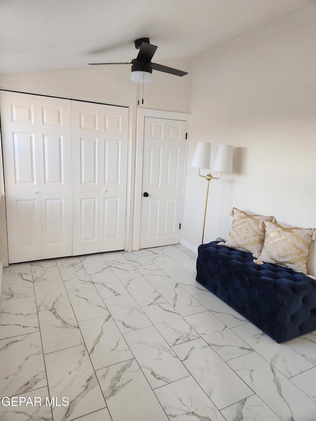 unfurnished bedroom with vaulted ceiling and ceiling fan