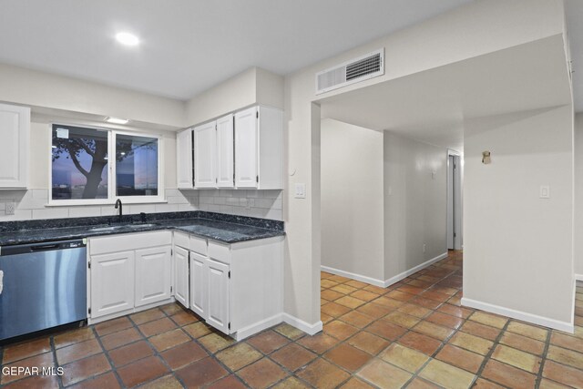 kitchen with stainless steel dishwasher, decorative backsplash, white cabinetry, and sink