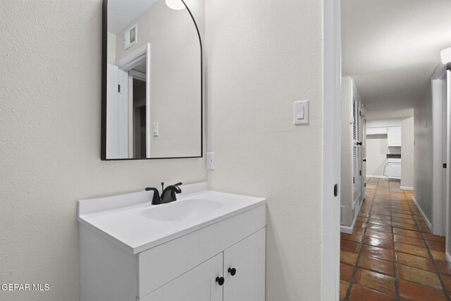 bathroom with vanity and tile patterned floors