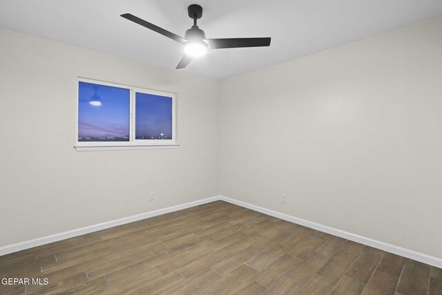 unfurnished room featuring hardwood / wood-style floors and ceiling fan