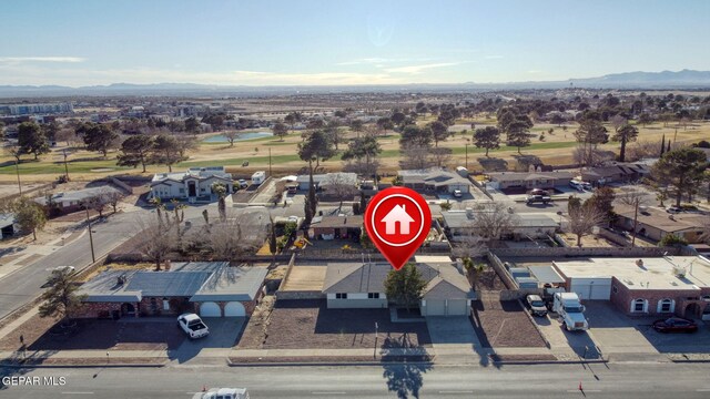 birds eye view of property featuring a mountain view