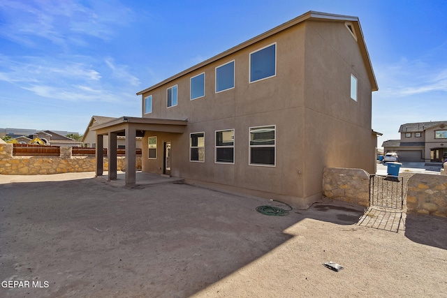 back of house with a patio