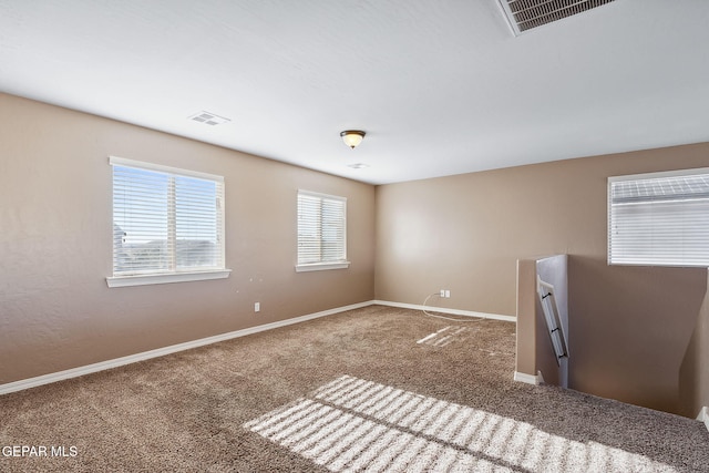 empty room featuring carpet flooring