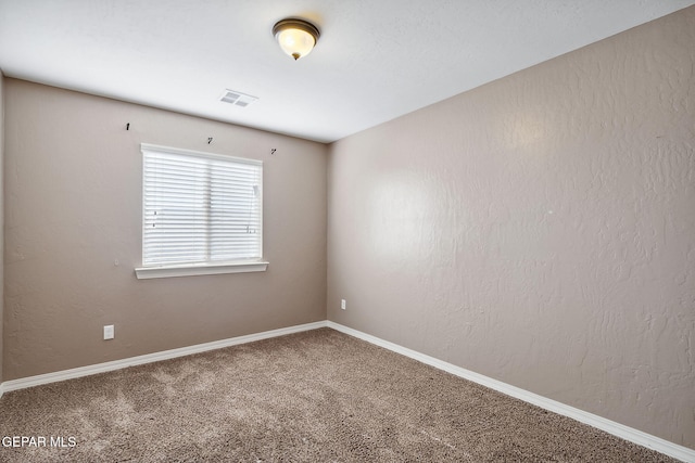 unfurnished room with carpet flooring