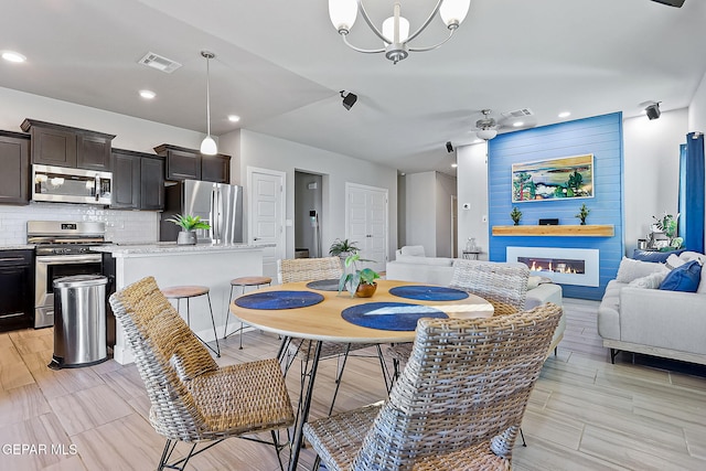 dining space with a chandelier